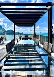 a pool on the deck of a house with a view of the ocean at S Resort El Nido in El Nido