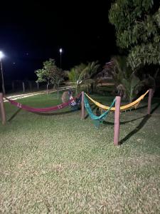 a hammock in a park at night at Sítio Barriguda in Alexânia