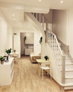 a living room with stairs leading to a bedroom at Benny's Rooms Brussels City Centre in Brussels