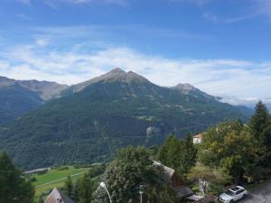 a view of a mountain with a car parked in front at Studio cabine ensoleillé pour 4 pers. proche pistes, animaux acceptés - FR-1-636-129 in Orcières +6 photos