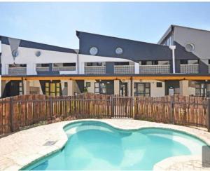 a swimming pool in front of a building at Maboneng Craftsmanship place in Johannesburg