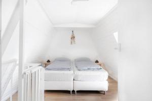 Postel nebo postele na pokoji v ubytování Vakantiewoning 't Juttershuis Egmond aan Zee