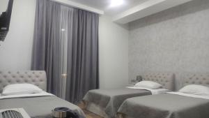 Voodi või voodid majutusasutuse Hotel Rustaveli toas