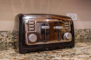 a toaster oven sitting on a kitchen counter at The Wrigleyville VIP-200 Steps from Wrigley Field in Chicago