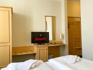 Postel nebo postele na pokoji v ubytování Bischofshof Braustuben