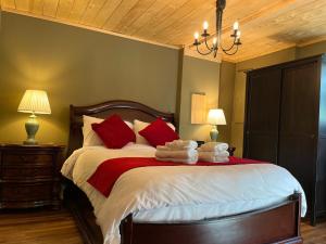 a bedroom with a large bed with towels on it at Frigon Suite -Waterfront in Port Alice