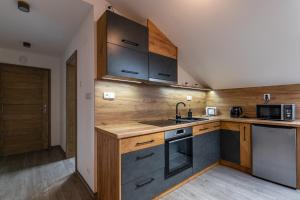 Kuchyňa alebo kuchynka v ubytovaní Apartmány Lucie