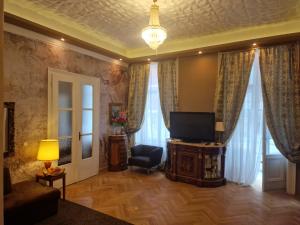 Televízia a/alebo spoločenská miestnosť v ubytovaní Urban Flats Vienna City Center