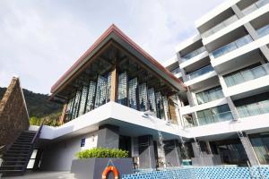 a large building with aificantificantificantificantificantbyterian church at The Yama Hotel Phuket - SHA Extra Plus in Kata Beach