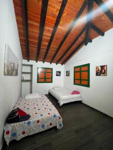 Postel nebo postele na pokoji v ubytování Finca Hotel karey -Quindio