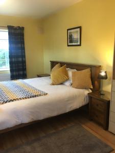 Postel nebo postele na pokoji v ubytování Oakwood B&B