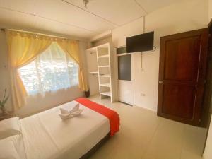 Voodi või voodid majutusasutuse Aparta-Hotel LENEMBERGER toas