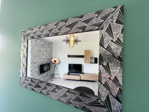 TV a/nebo společenská místnost v ubytování COLMAR - Appartements Deluxe - Lumineux - Stationnement Gratuit et Facile dans la rue