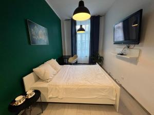 Posteľ alebo postele v izbe v ubytovaní Apartamenty Nowy Rynek