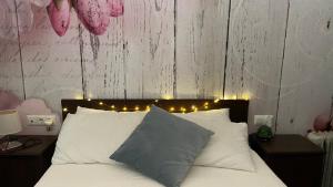 Posteľ alebo postele v izbe v ubytovaní Hope's ático-apartamento