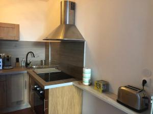 a kitchen with a sink and a stove at le calme à Salernes in Salernes