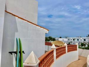 a view from the balcony of a resort with surfboards at Golden Wave Surf Villa in Corralejo