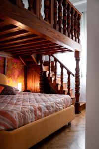 a bedroom with a loft bed with a staircase at Tetide Home in Palermo