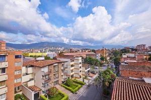 an aerial view of a city with buildings at Hotel Pass, Laureles Medellín in Medellín