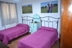 Ένα ή περισσότερα κρεβάτια σε δωμάτιο στο Finca el Vizconde Naturaleza con tus hijos