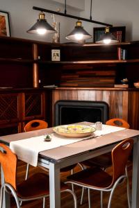 a table with a plate of food on top of it at Tetide Home in Palermo