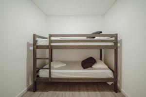 Katil atau katil-katil dalam bilik di Gaia Terrace With Elevator by Vacationy
