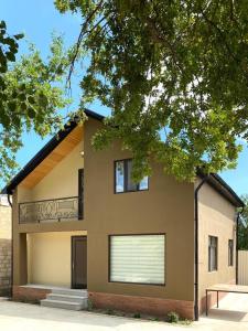 a house with a window and a garage at Shale Qusar in Qusar