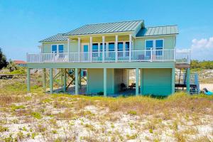 a house on top of a beach at Driftwood in St. George Island
