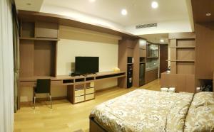 a bedroom with a bed and a flat screen tv at U Residence Tower2 Supermal Lippo Karawaci in Klapadua