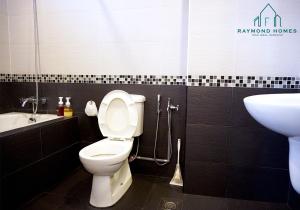 a bathroom with a toilet and a sink at 99 Kelawei in George Town +48 photos