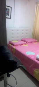 Ένα ή περισσότερα κρεβάτια σε δωμάτιο στο Apartaestudio 4 Amoblado el Caney