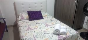 Ένα ή περισσότερα κρεβάτια σε δωμάτιο στο Apartaestudio 4 Amoblado el Caney