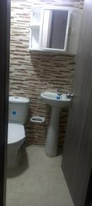 Ένα μπάνιο στο Apartaestudio 4 Amoblado el Caney