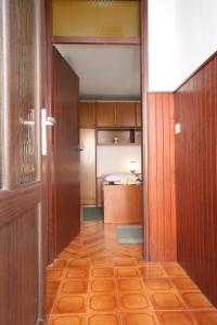 a hallway leading to a room with a bed at Apartments with a parking space Cavtat, Dubrovnik - 8986 in Mlini