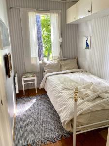 A bed or beds in a room at Escape to Your Very Own Private Island - Just 30 Minutes from Stockholm