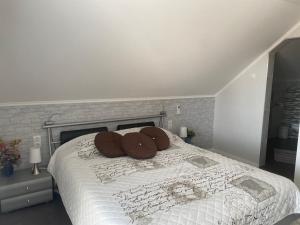 A bed or beds in a room at Maria Vendéghaz
