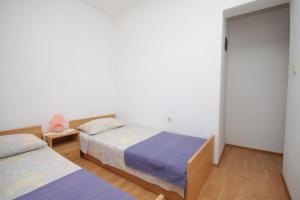 Posteľ alebo postele v izbe v ubytovaní Apartment Sali 8152b