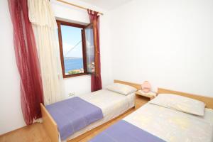 Posteľ alebo postele v izbe v ubytovaní Apartments with a parking space Sali, Dugi otok - 8152