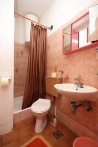 a bathroom with a toilet and a sink and a shower at Rooms by the sea Luka, Dugi otok - 8132 in Žman