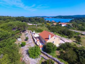 an aerial view of a house with a lake at Holiday house with a parking space Veli Rat, Dugi otok - 8096 in Veli Rat