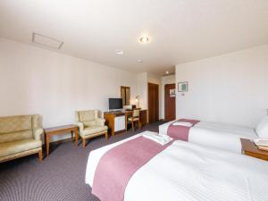 Tabist Abashiri Central Hotel客房内的一张或多张床位
