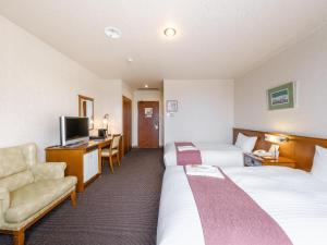 Tabist Abashiri Central Hotel客房内的一张或多张床位
