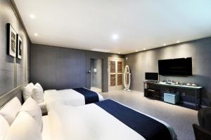 Postel nebo postele na pokoji v ubytování Buan Tourist Hotel