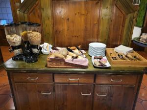 a counter with a bunch of food on it at Historik Hotel Ochsen in Tamm
