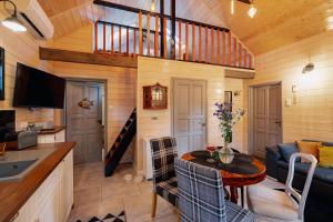 a kitchen and living room in a tiny house at White & Black in Kołczewo