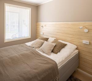 Postel nebo postele na pokoji v ubytování Tuomenkartano Apartments by Hiekka Booking