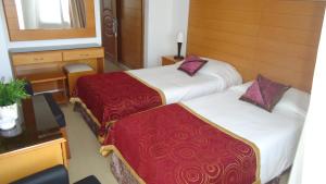 Postel nebo postele na pokoji v ubytování Ada Beach Hotel