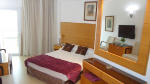 Postel nebo postele na pokoji v ubytování Ada Beach Hotel
