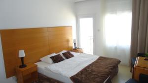 Postel nebo postele na pokoji v ubytování Ada Beach Hotel