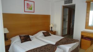Postel nebo postele na pokoji v ubytování Ada Beach Hotel